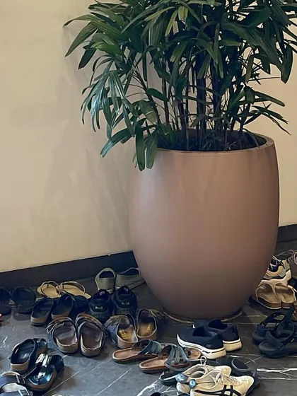 A pile of shoes outside our workshop space. This simple image is a beautiful symbol of a community coming together to leave their worldly concerns at the door and step onto the mat.