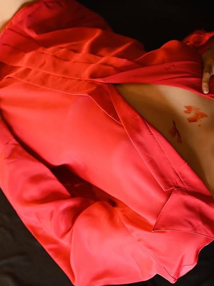 A close-up version of the conceptual red shirt shoot, focusing on the emotion and details.