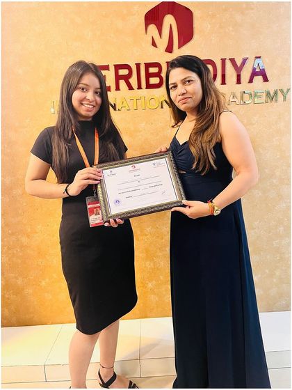 A personal moment of achievement as our director presents the certificate to a proud graduate.