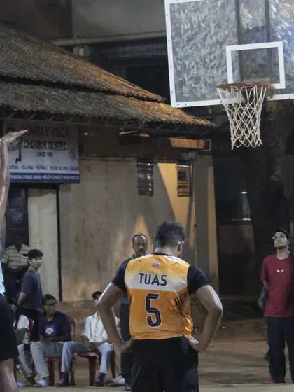 A player at the free-throw line, focused on sinking a crucial shot during the semi-finals.