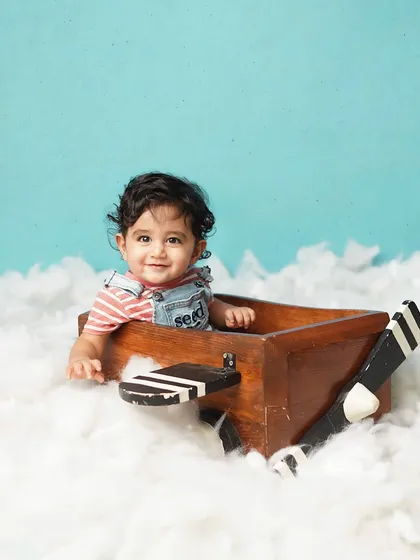 A sweet, happy smile from the aviator. His curly hair and bright eyes make this a captivating portrait.