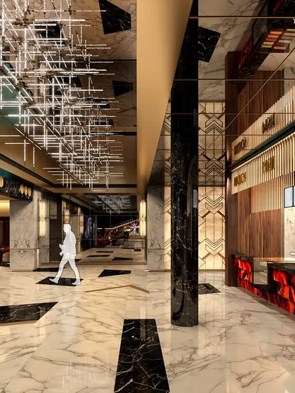 Another view of the cinema lobby, showcasing the VIP concierge and bar area. The design offers personalized services and signature cocktails, with stunning city views from the large windows providing a perfect backdrop.