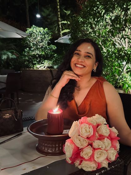 A candlelit dinner photo from our anniversary. This image captures the romantic and intimate side of our celebration, reminding my audience of the importance of couple time.