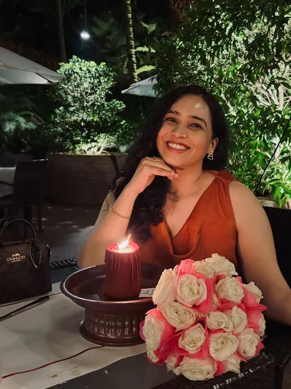 A candlelit dinner photo from our anniversary. This image captures the romantic and intimate side of our celebration, reminding my audience of the importance of couple time.
