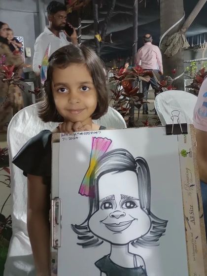 A sweet little girl with her caricature. The colorful hair clip was a fun detail to add.