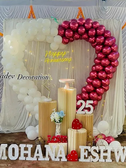 Celebrating a silver jubilee is a special milestone. I designed this heart-shaped balloon arch in chrome magenta and white for a 25th-anniversary party, complete with marquee numbers and personalized name cutouts.