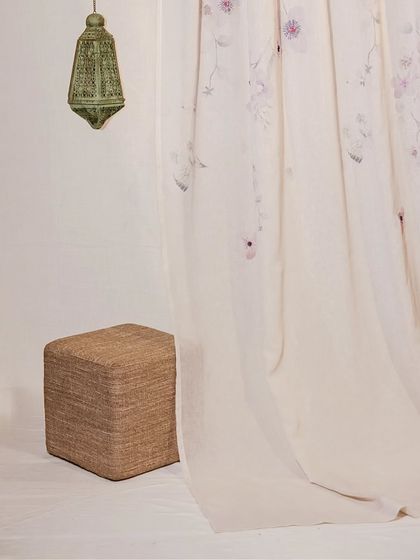 A dreamy, lightweight sheer curtain with a delicate, watercolor-style floral print. This design adds a touch of romance and artistry to a room, allowing light to filter through the soft, ethereal blooms.