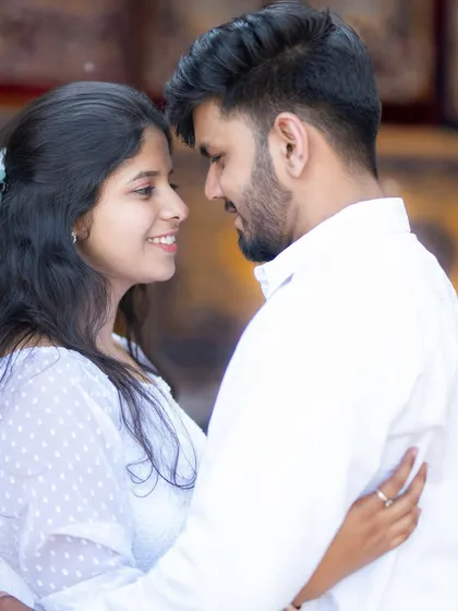 A classic, romantic close-up portrait of a couple, capturing the love and anticipation before their wedding.