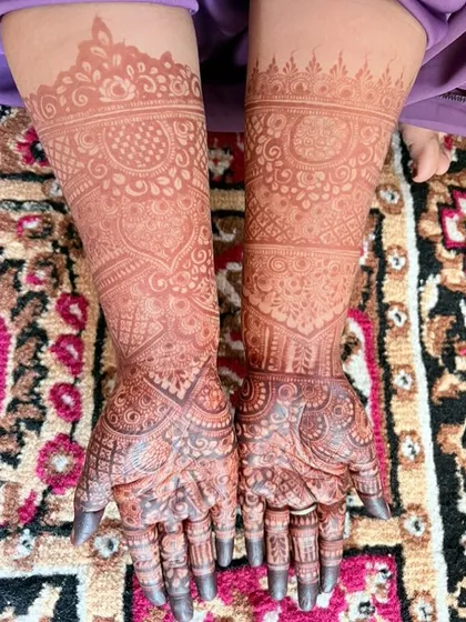The full view of both arms, showcasing the impressive color payoff from my homemade henna.