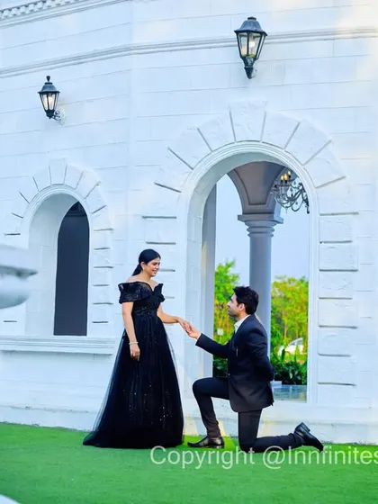 A classic proposal shot, perfectly framed by the arches of our white European villa set. A timeless moment for any couple's love story.