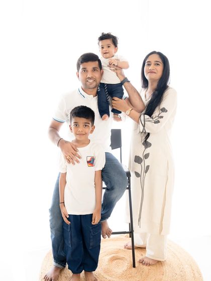 A fun pose with the youngest member of the family perched on dad's shoulders.