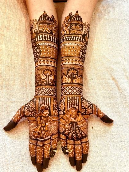 Another angle of the beautiful bridal design, showcasing the intricate details of the figures and patterns.