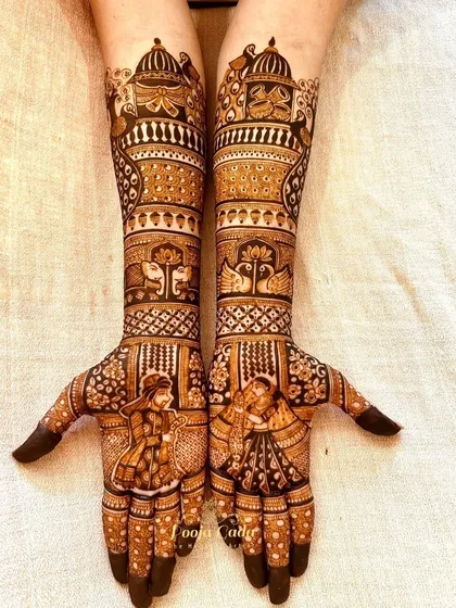 Another angle of the beautiful bridal design, showcasing the intricate details of the figures and patterns.