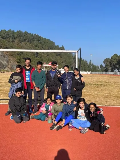 A moment of rest and camaraderie on the track during our high-altitude camp. These camps are as much about building friendships and team spirit as they are about physical training.
