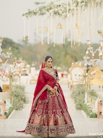 Here is my bride Janvi, walking down the aisle. Her complete look, from the flowing lehenga to the glowing makeup, was designed to be breathtaking from every angle.