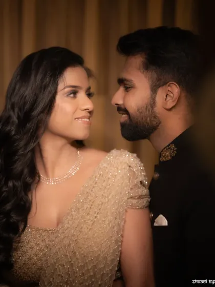 A classic and romantic couple portrait. The soft lighting and their gentle expressions create a timeless and elegant look.
