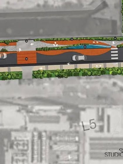 This masterplan detail for Embassy Manyata Tech Park shows the design for a street intersection and roundabout. The plan includes pedestrian crossings, curved pathways, and green islands to manage traffic flow and enhance the pedestrian experience.