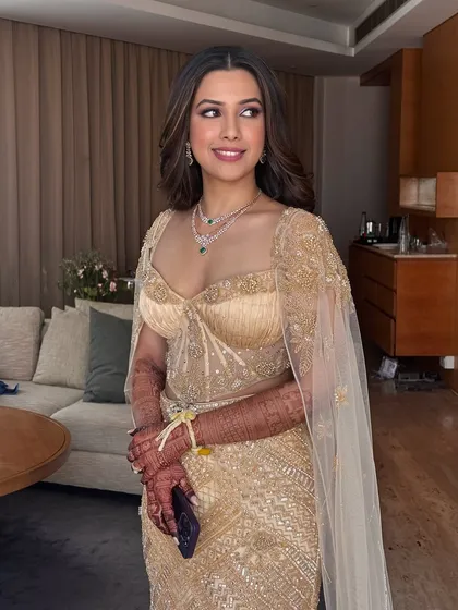 This is the essence of my work: creating a look that is both timeless and breathtaking. For this reception glam, we focused on a flawless, glowing base that looks like second skin, paired with soft, sultry eyes and a defined lip. The goal was to complement her magnificent golden gown and make her shine with confidence.
