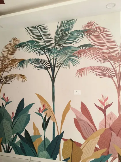 A detailed shot of the stylized palm tree mural, highlighting the clean lines and beautiful color combinations that give it a modern, artistic feel.