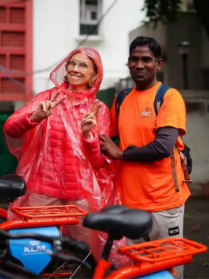 Even a little rain can't dampen our spirits. This rider is all smiles with one of our guides, ready for an adventure in any weather.