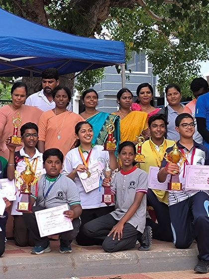 A wider view of our victorious team and their supporters at the ICSE Regional Archery Tournament. The collective joy and pride in this photo define what our academy is all about.