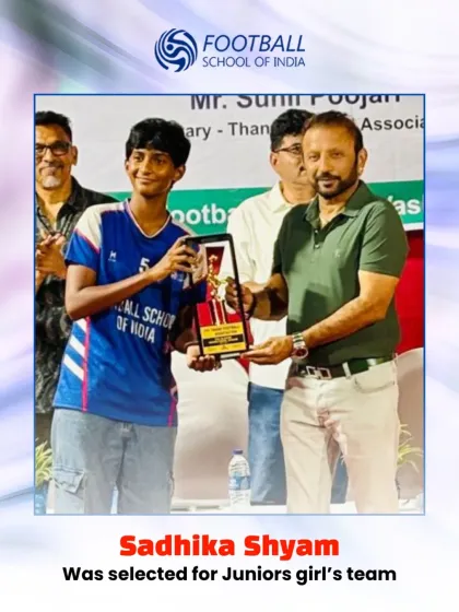 Sadhika Shyam receiving an award for her selection to the Juniors girl's team, a proud moment for her and the academy.