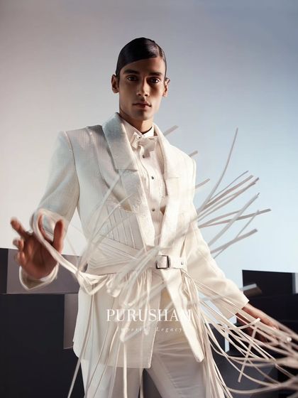 The movement of the fringes on this belted white jacket adds a dynamic, playful element to a sharp, tailored look. It is a vibrant ode to the sun-kissed season.