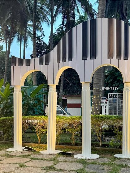 A unique, oversized piano sculpture that served as a major photo prop and decorative element for the music theme.