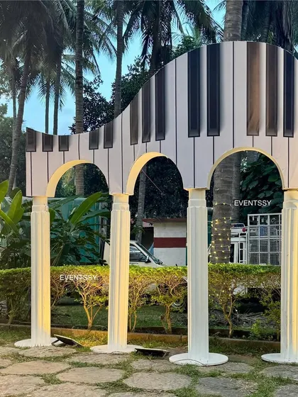 A unique, oversized piano sculpture that served as a major photo prop and decorative element for the music theme.