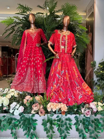 Another view of our retail installation for BIBA, where mannequins are set amidst a bed of artificial flowers and greenery. This type of visual merchandising creates a memorable and immersive brand experience.
