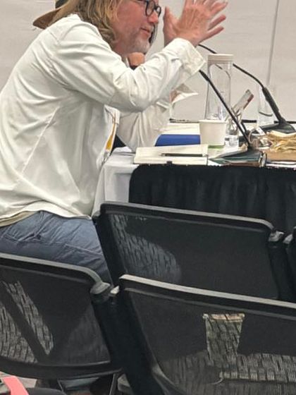 A close-up of a jury member at the World Architecture Festival, deeply engaged in a project presentation. It is in these moments of critical review that architectural excellence is truly tested.