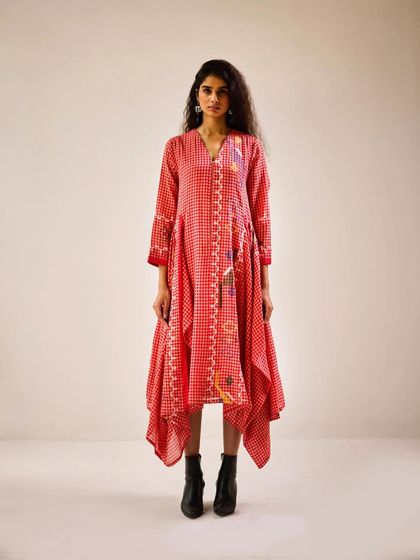 This red and white printed dress with an asymmetric hemline was styled for a festive lookbook. I paired it with black boots to give the traditional print an edgy, contemporary feel, showcasing its versatility.