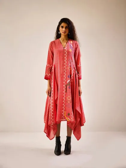 This red and white printed dress with an asymmetric hemline was styled for a festive lookbook. I paired it with black boots to give the traditional print an edgy, contemporary feel, showcasing its versatility.