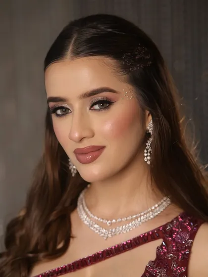 A powerful portrait. The bold nude lip and defined eyes create a look of confidence and allure.