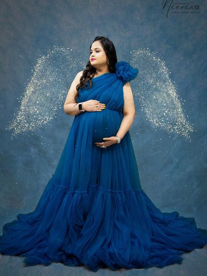This royal blue gown is so vibrant and beautiful. The soft tulle and one-shoulder design are very flattering, and it looks stunning against a simple studio backdrop.