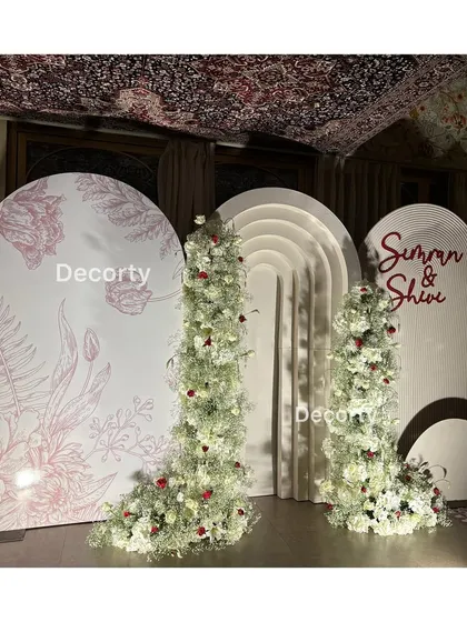 A full view of the stylish anniversary backdrop, combining modern design with classic floral decor.