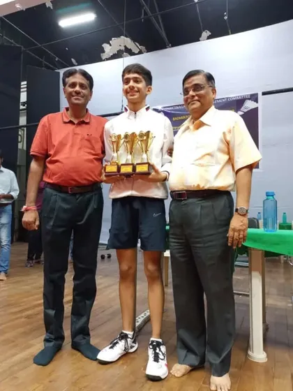 Anmol with his coaches, celebrating his outstanding performance across three different age categories.