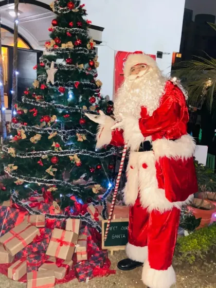 Our Santa Claus stands ready to welcome guests next to a beautifully decorated Christmas tree. We can provide both the character and the festive decorations for your holiday party.