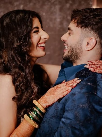 A happy, candid moment between the couple, stolen away from the dance floor.