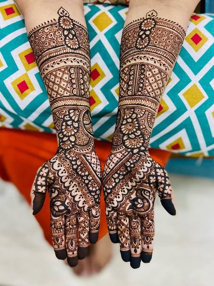 An elegant Indo-Arabic design with a mix of bold paisleys and delicate filler patterns.