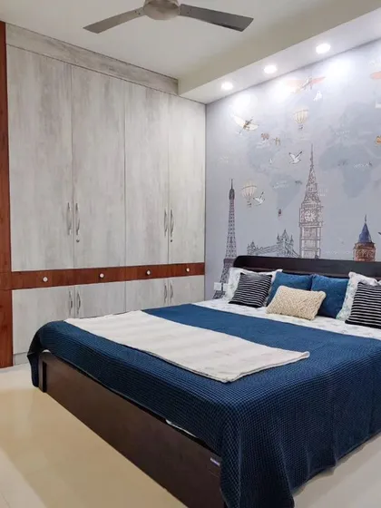 Kid's Room Before & After: This transformation shows how a blank room becomes a sophisticated yet fun kid's bedroom. The design features a world-map accent wall and a two-tone wardrobe with an integrated study nook for a timeless look.