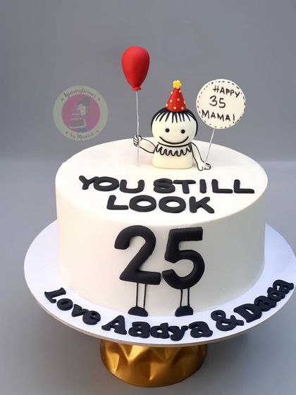 A fun and minimalist doodle cake that says "You Still Look 25" for a 35th birthday. Simple, witty, and stylish.