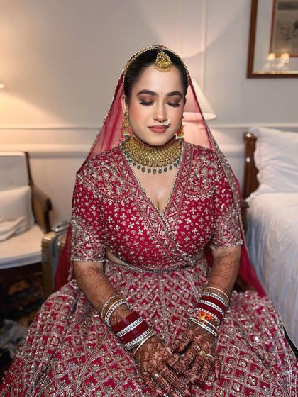 Seated portrait of my bride, looking serene and beautiful. The makeup is designed to be comfortable and long-lasting, even during long ceremonies.