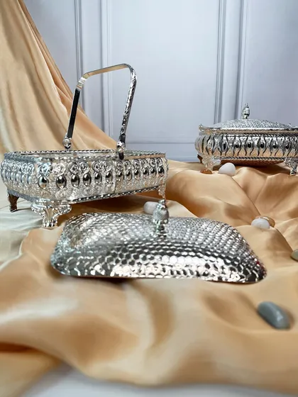 This arrangement shows the variety in our collection of silver-plated baskets, perfect for any gifting or decor need. Each piece is designed to be a treasure.