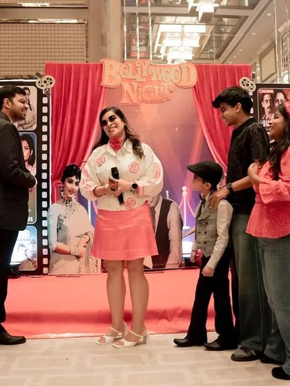 The stage is set for a night of celebration. Here, guests are enjoying the spotlight on the "Bollywood Night" stage. I design event flows that include moments for recognition, speeches, and entertainment.
