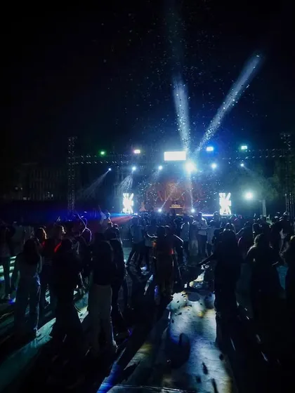 A wide shot of the DJ night at Terna Medical College. The stage lighting and massive crowd create an epic concert atmosphere.