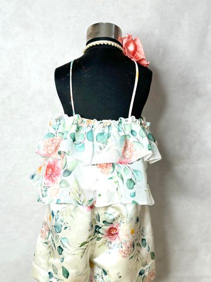 The back view of our floral holiday set, showing the thin straps and pretty flower detail at the neck.