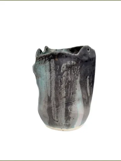 I call this one 'Ocean Pearl'. The dripping blue and black glaze reminds me of the deep, endless beauty of the ocean.