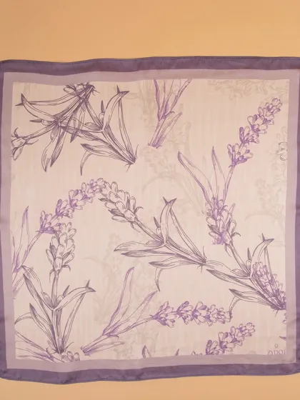 A flat-lay of the lavender floral pocket square, detailing the delicate line-art pattern.