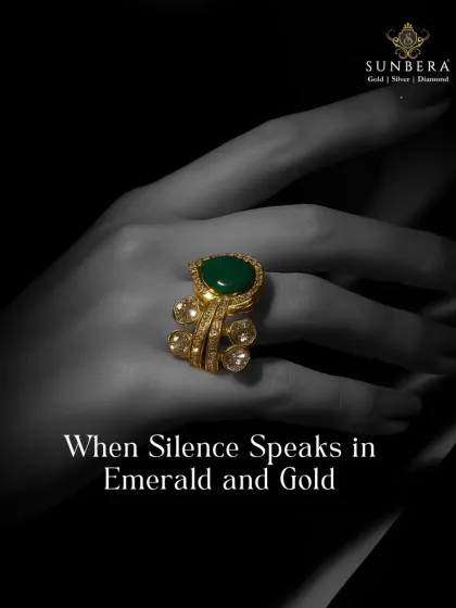 This bold statement ring combines the richness of gold with a large, captivating emerald, surrounded by sparkling polki diamonds. It’s a piece that speaks of regal elegance and silent confidence.